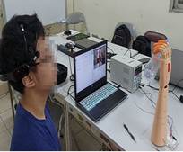 ''A person sitting at a desk with a computer

Description automatically generated''